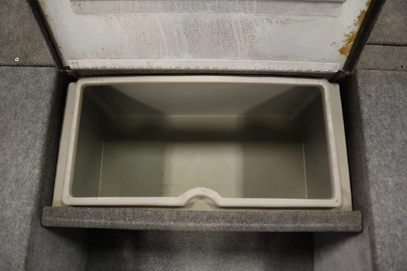 Slide: The Image of Open storage compartment in 1997 Tracker 18 Pro Team SC boat. - 21