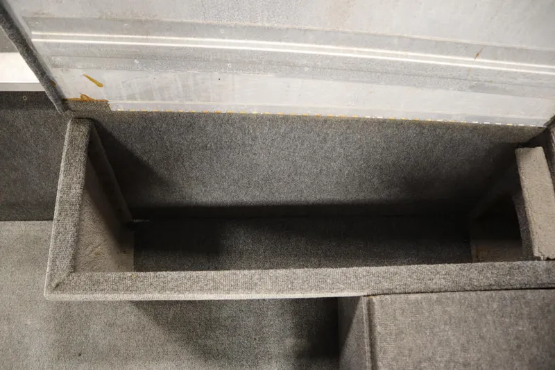 Slide: The Image of Interior storage compartment of a 1997 Tracker 18 Pro Team SC boat. - 22