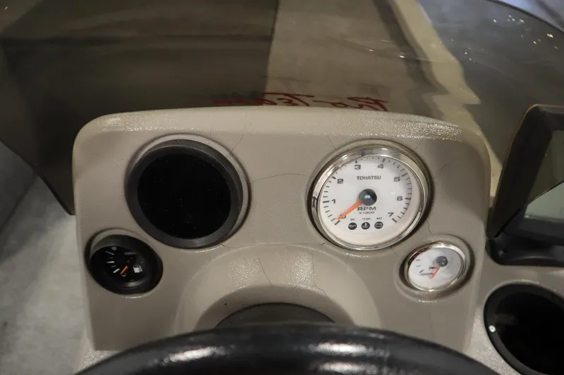 Slide: The Image of Dashboard of a 1997 Tracker 18 Pro Team SC boat with Tohatsu RPM gauge. - 27