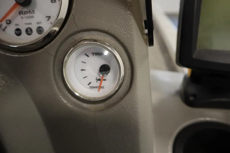 Slide: The Image of Dashboard of 1997 Tracker 18 Pro Team SC boat with Tohatsu trim gauge. - 28