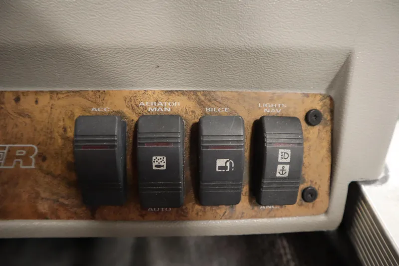 Slide: The Image of Control panel of a 1997 Tracker 18 Pro Team SC boat with labeled switches. - 29