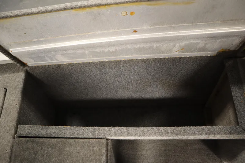 Slide: The Image of Interior storage compartment of a 1997 Tracker 18 Pro Team SC boat. - 32