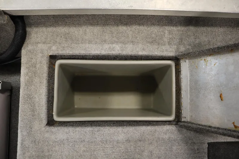 Slide: The Image of Interior storage compartment of a 1997 Tracker 18 Pro Team SC boat. - 39