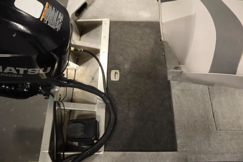 Slide: The Image of Interior view of a 1997 Tracker 18 Pro Team SC boat with Tohatsu engine. - 40