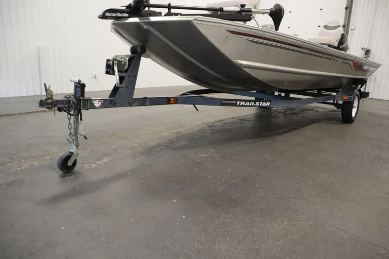 Slide: The Image of 1997 Tracker 18 Pro Team SC boat on Trailstar trailer in indoor setting. - 47