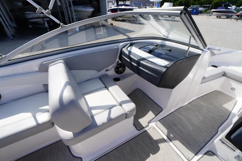 Slide: The Image of Interior of 2019 Regal 1900 ES Bowrider boat with seating and dashboard. - 10