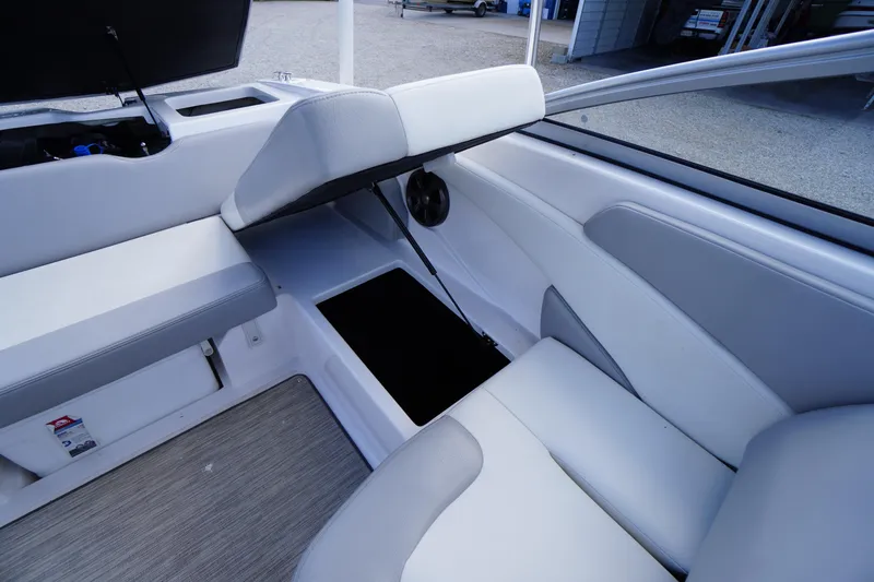 Slide: The Image of 2019 Regal 1900 ES Bowrider interior seating and storage compartment. - 16