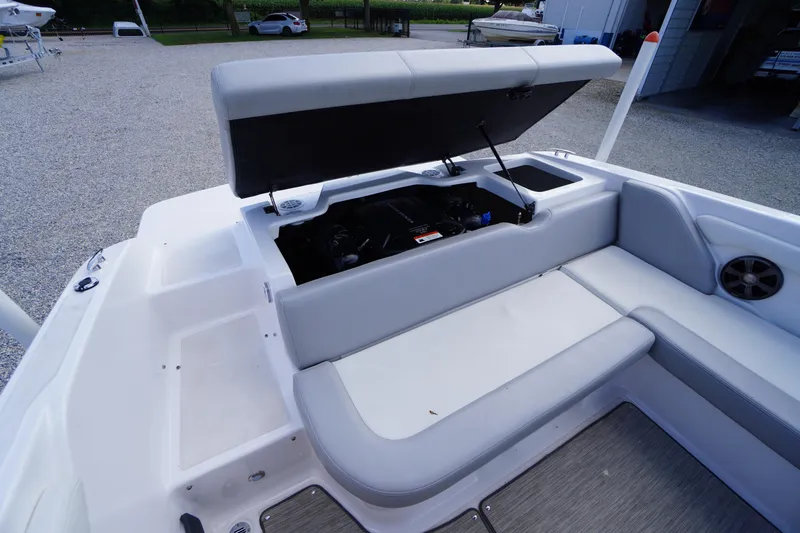 Slide: The Image of 2019 Regal 1900 ES Bowrider boat interior with open engine compartment and seating area. - 18