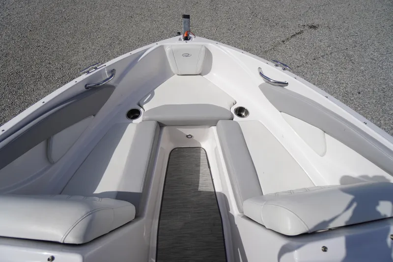 Slide: The Image of 2019 Regal 1900 ES Bowrider interior with white seating and stainless steel accents. - 2