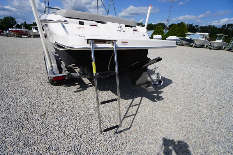 Slide: The Image of 2019 Regal 1900 ES Bowrider boat on trailer, rear view with ladder and propeller. - 25