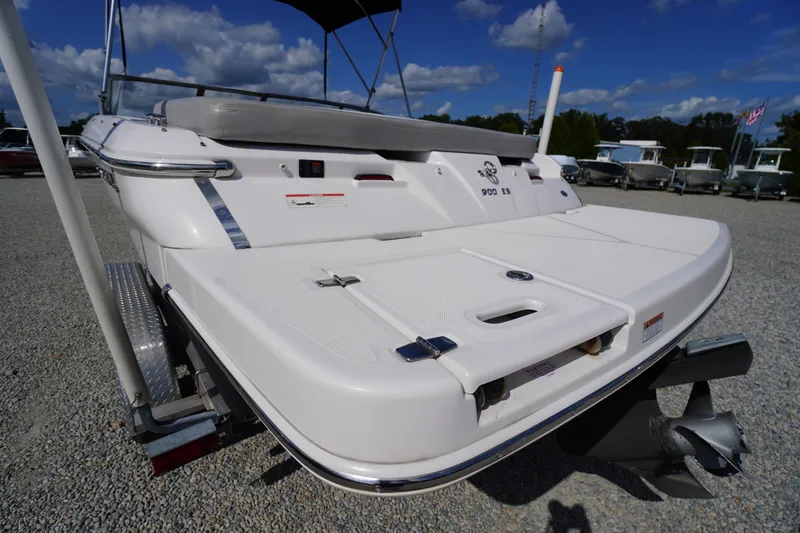Slide: The Image of 2019 Regal 1900 ES Bowrider boat rear view with swim platform and outboard motor. - 28