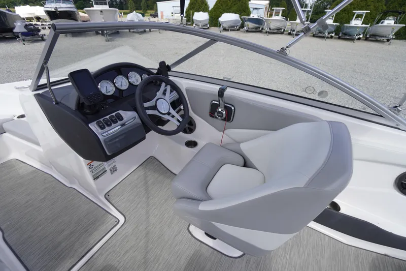 Slide: The Image of 2019 Regal 1900 ES Bowrider interior with steering wheel and dashboard controls. - 3