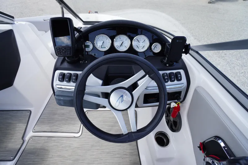 Slide: The Image of 2019 Regal 1900 ES Bowrider dashboard with steering wheel and instrument panel. - 4