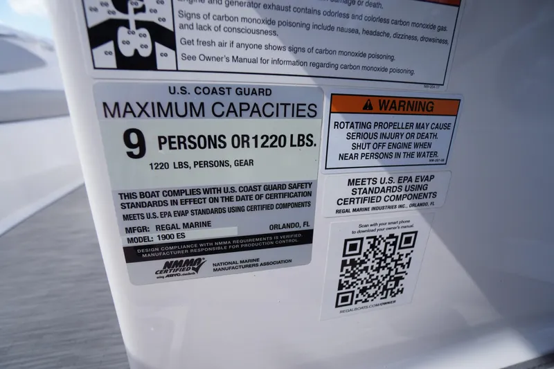 Slide: The Image of 2019 Regal 1900 ES Bowrider capacity label, 9 persons or 1220 lbs, safety warnings included. - 8