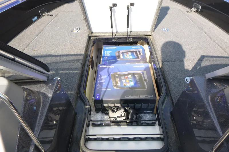 Slide: The Image of 2024 Ranger 621FS Pro boat storage with electronic equipment boxes inside. - 10