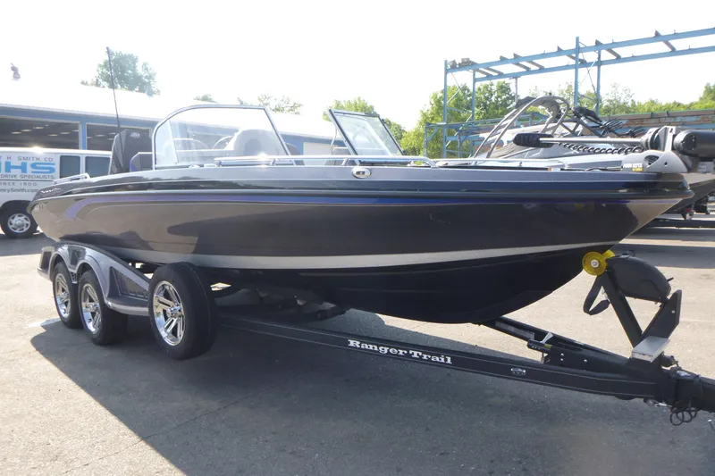 Slide: The Image of 2024 Ranger 621FS Pro boat on trailer, parked outdoors. - 3