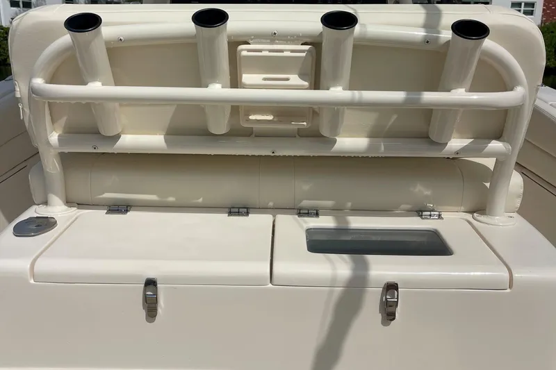 Slide: The Image of 2022 Grady-White Canyon 271 boat with rod holders and storage compartments. - 13