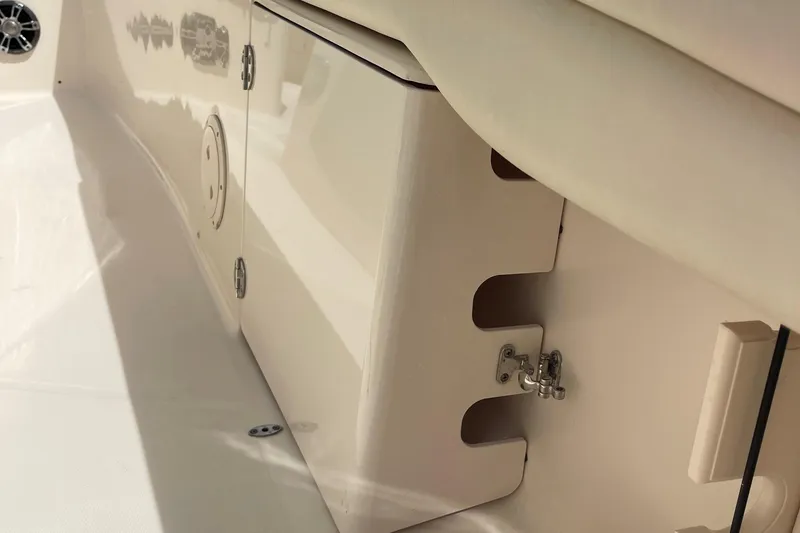 Slide: The Image of 2022 Grady-White Canyon 271 boat interior, featuring storage compartments and sleek design elements. - 17