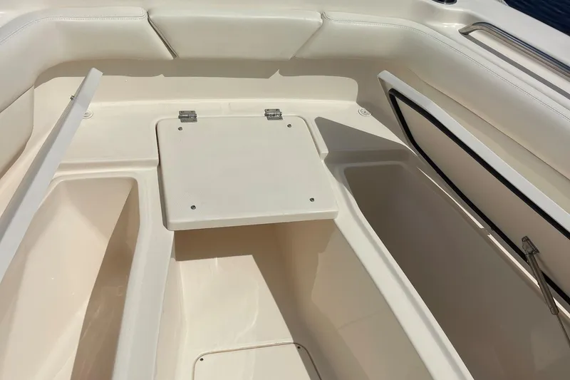 Slide: The Image of 2022 Grady-White Canyon 271 boat interior storage compartments. - 18