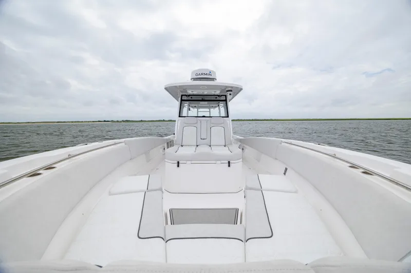 Slide: The Image of 2022 Sea Fox 368 Commander boat on open water, showcasing spacious deck and modern design. - 14