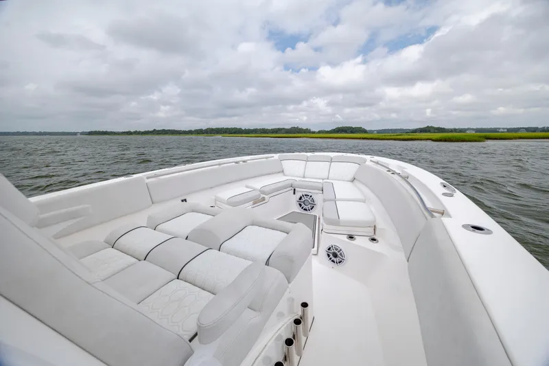 Slide: The Image of Luxurious seating on 2022 Sea Fox 368 Commander boat, cruising on a serene waterway. - 16