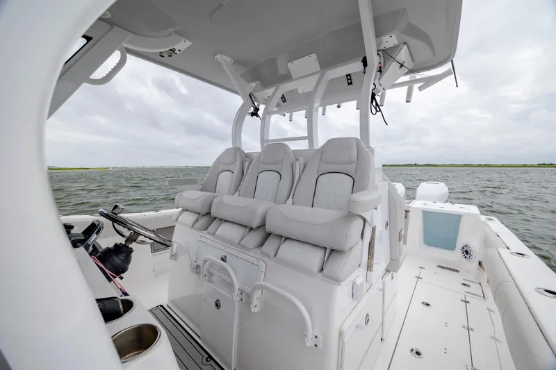 Slide: The Image of 2022 Sea Fox 368 Commander boat interior with luxurious seating on open water. - 19