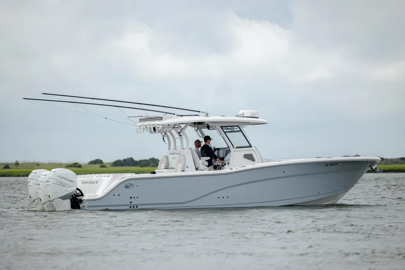 Slide: The Image of 2022 Sea Fox 368 Commander boat cruising on a calm waterway. - 2