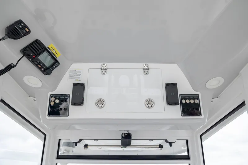 Slide: The Image of 2022 Sea Fox 368 Commander boat console with communication and control panels. - 23