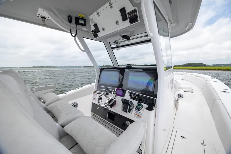 Slide: The Image of 2022 Sea Fox 368 Commander boat interior with advanced navigation system on open water. - 24