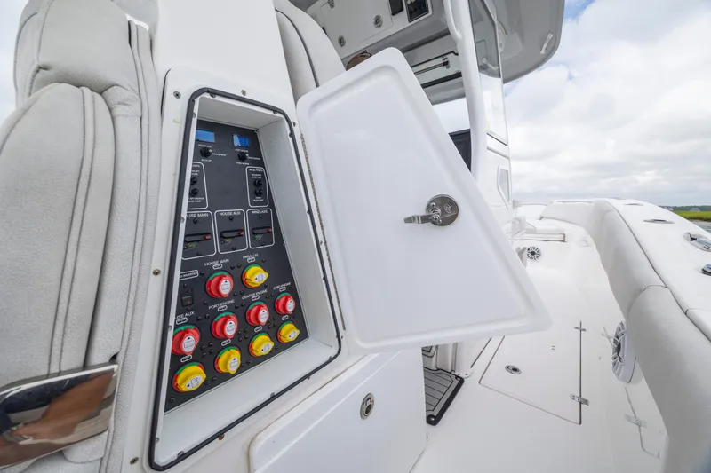 Slide: The Image of 2022 Sea Fox 368 Commander electrical panel with open access door on deck. - 26