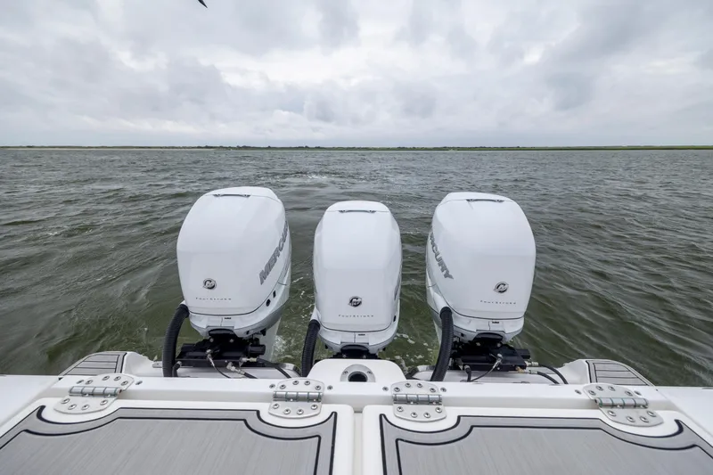 Slide: The Image of 2022 Sea Fox 368 Commander with triple Mercury outboard engines on open water. - 39