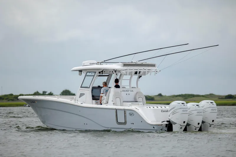 Slide: The Image of 2022 Sea Fox 368 Commander boat with triple outboard engines on water. - 5