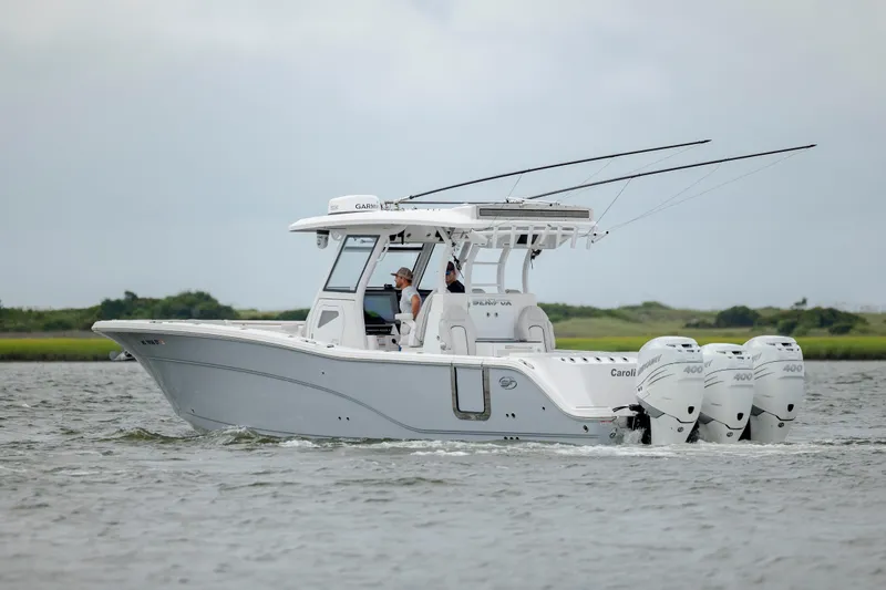 Slide: The Image of 2022 Sea Fox 368 Commander boat cruising on water with triple engines. - 6