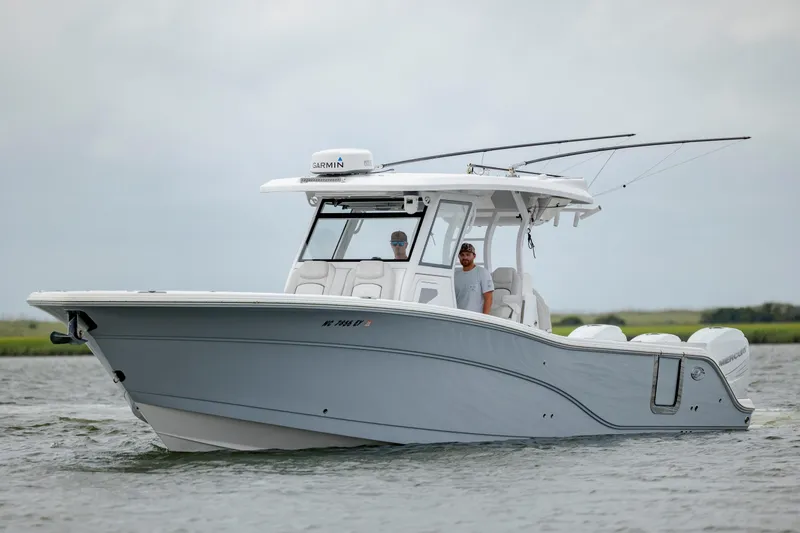 Slide: The Image of 2022 Sea Fox 368 Commander boat cruising on water with two people onboard. - 8