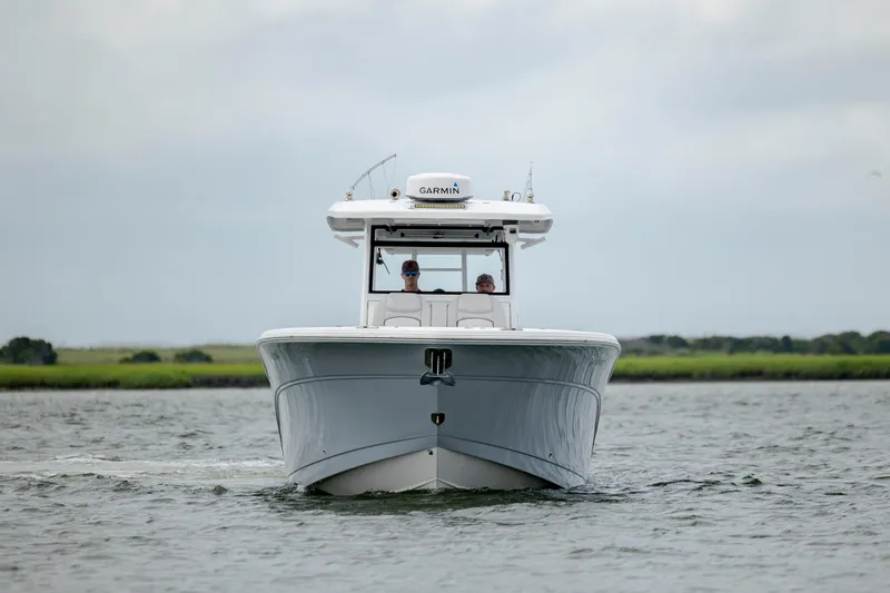 Slide: The Image of 2022 Sea Fox 368 Commander boat cruising on a calm waterway. - 9