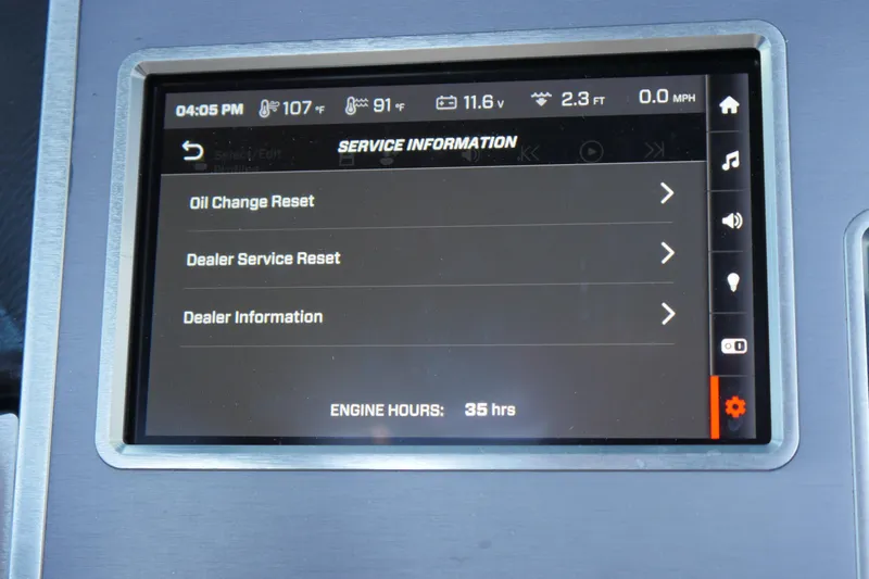 Slide: The Image of 2023 MasterCraft XT20 service information screen displaying maintenance options and engine hours. - 13