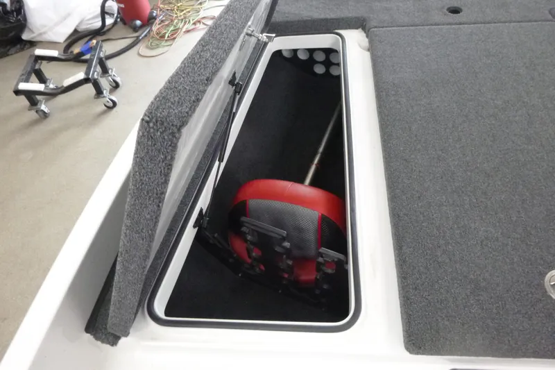 Slide: The Image of 2025 Ranger Z185 boat deck with gray carpet and storage compartments. - 10