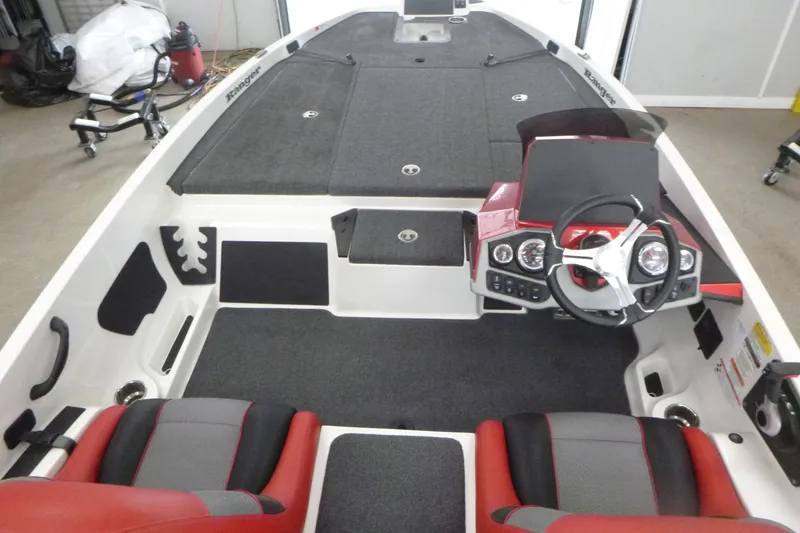 Slide: The Image of 2025 Ranger Z185 boat with red accents on a trailer in a showroom. - 4