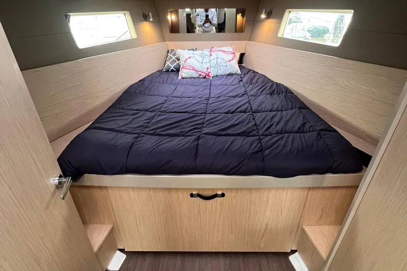 Slide: The Image of Cozy cabin interior of 2019 Beneteau Oceanis 41.1 with a comfortable bed. - 4