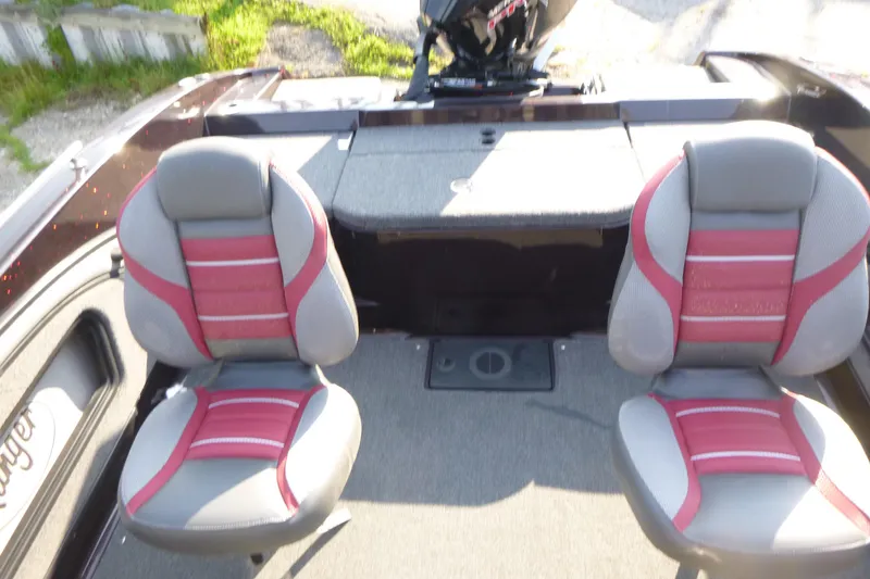 Slide: The Image of 2024 Ranger 2080MS boat interior with two gray and red seats. - 10