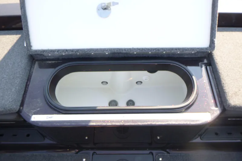 Slide: The Image of 2024 Ranger 2080MS boat livewell with open lid, showcasing interior design. - 11
