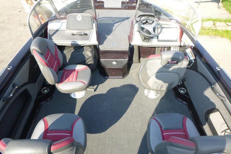 Slide: The Image of 2024 Ranger 2080MS boat interior with four seats, steering console, and carpeted flooring. - 5