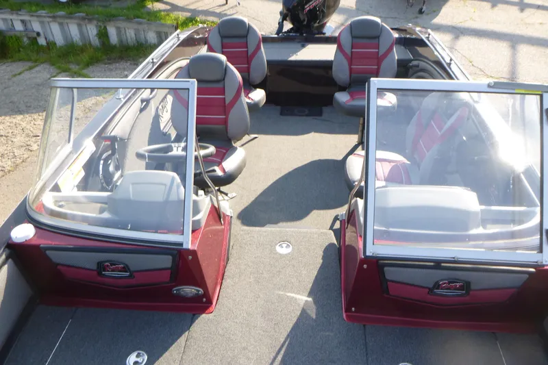 Slide: The Image of 2024 Ranger 2080MS boat interior with red and gray seating, dual consoles, and steering wheel. - 6