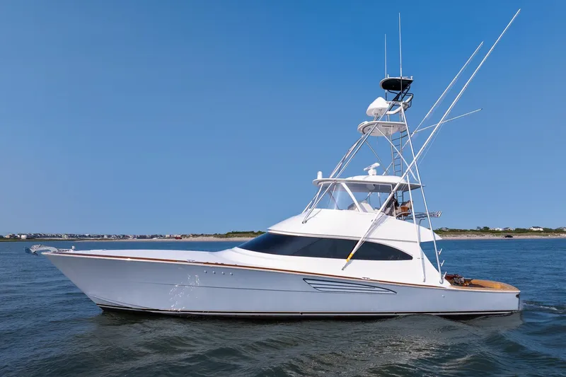 The Image of 2026 Viking 64 Convertible yacht on open water, clear blue sky background. - 0