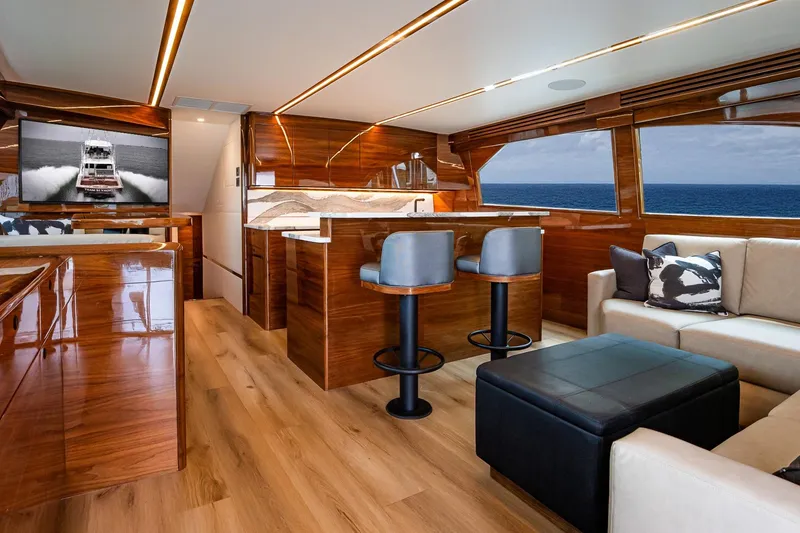 Slide: The Image of Luxurious interior of 2025 Viking 64 Convertible yacht with ocean view and modern furnishings. - 25
