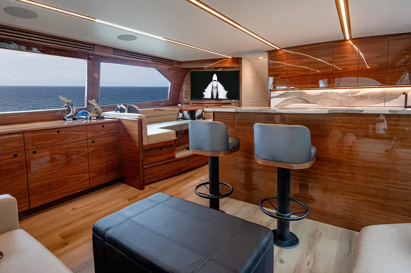 Slide: The Image of Luxurious interior of 2025 Viking 64 Convertible yacht with ocean view and modern furnishings. - 27