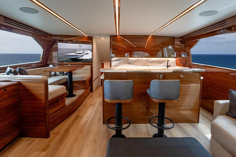 Slide: The Image of Luxurious interior of 2025 Viking 64 Convertible yacht with elegant wood finishes and ocean view. - 29