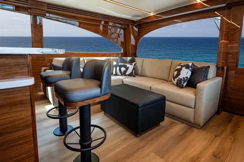 Slide: The Image of Luxurious interior of 2025 Viking 64 Convertible yacht with ocean view. - 31