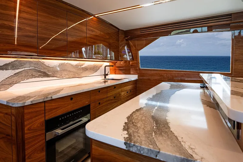 Slide: The Image of Luxurious kitchen interior of 2025 Viking 64 Convertible yacht with ocean view. - 33