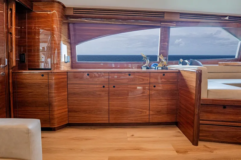 Slide: The Image of Luxurious interior of 2025 Viking 64 Convertible yacht with elegant wood finish. - 35